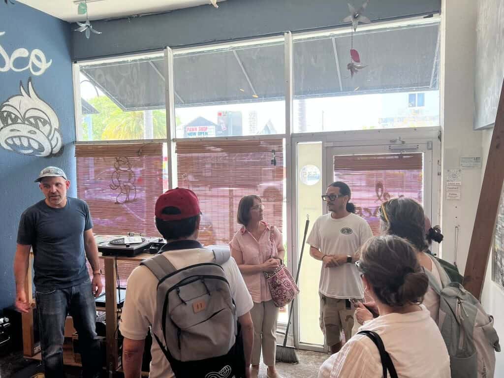 Teachers interacting with hip-hop artists at a East Little Havana gallery space.