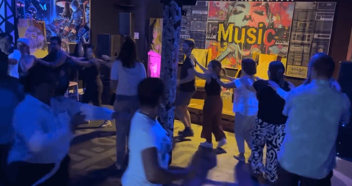 Participants dancing in a "conga line" in culmination of Little Havana experience.